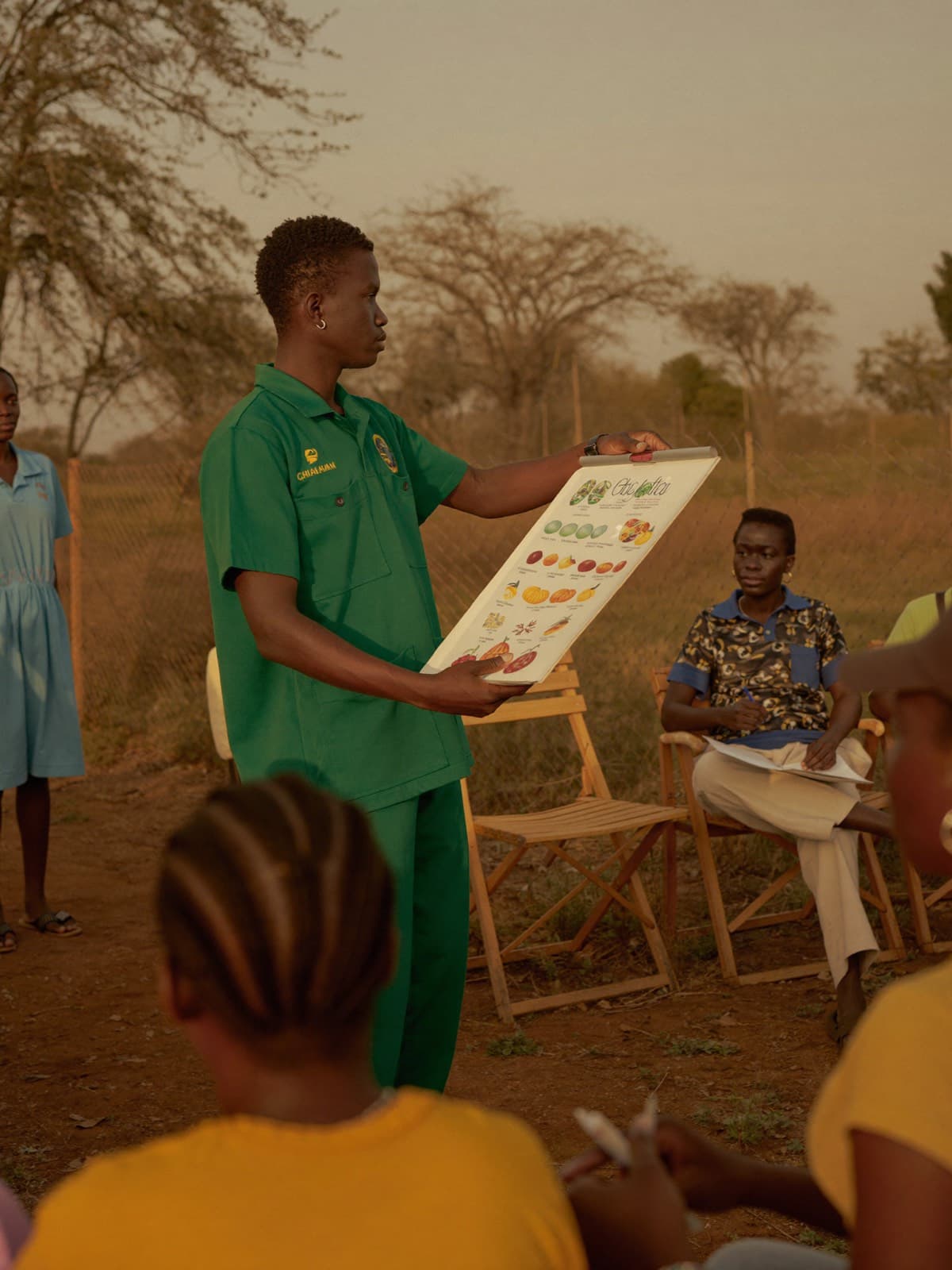 A student leader teaching a community health education session