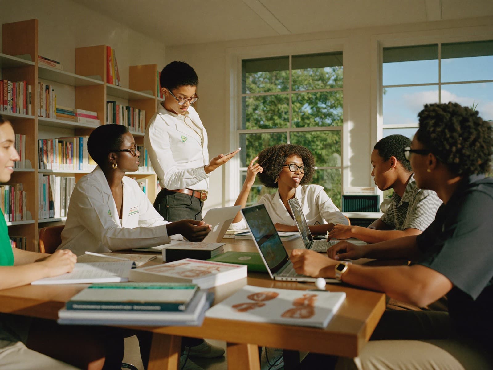 Health students studying together around a table
